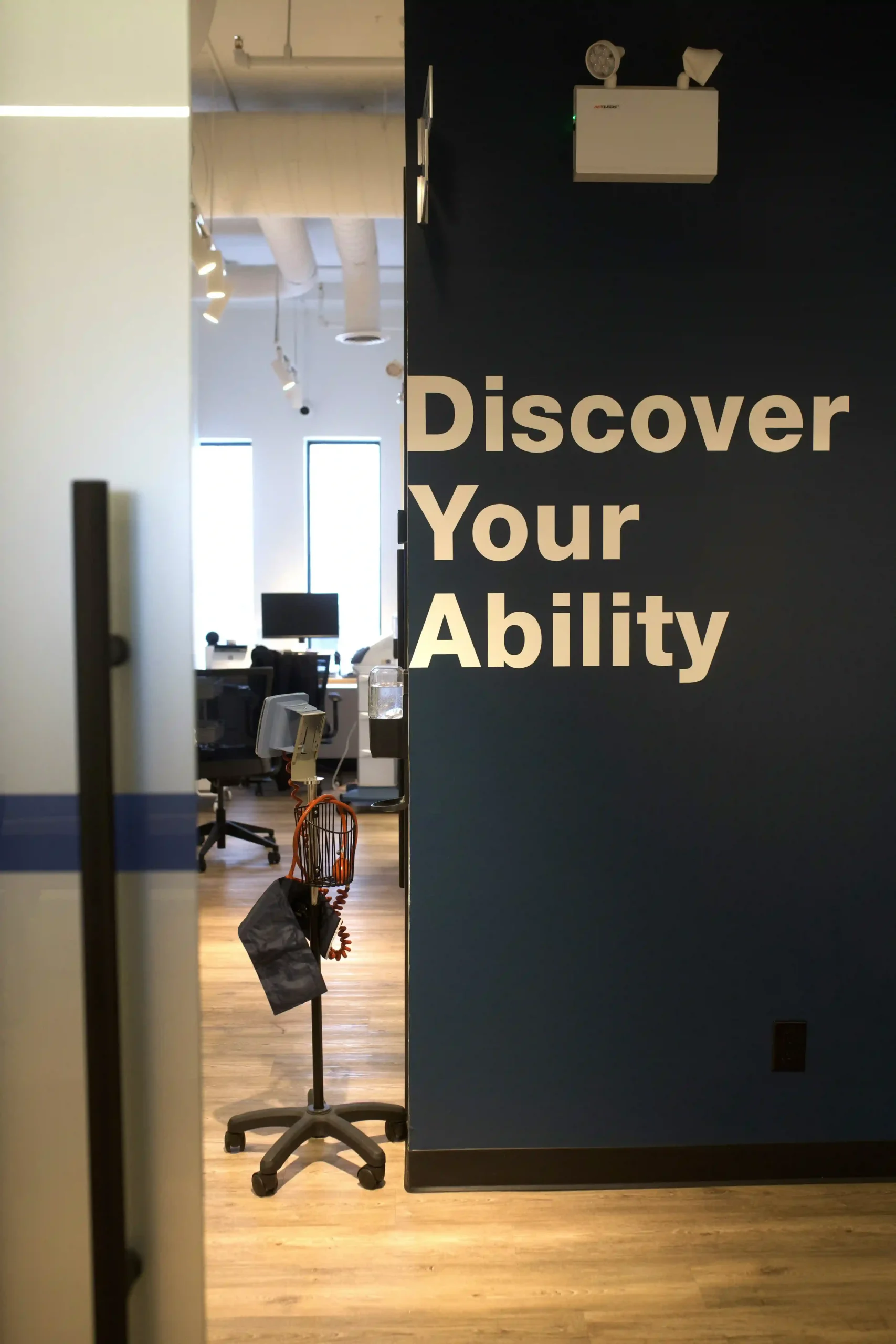 Interior of The Ability Clinic with “Discover Your Ability” wall signage